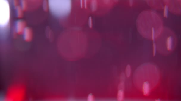 Primer plano de brote de hermosas burbujas luces de color rosa y fondo bokeh — Vídeos de Stock