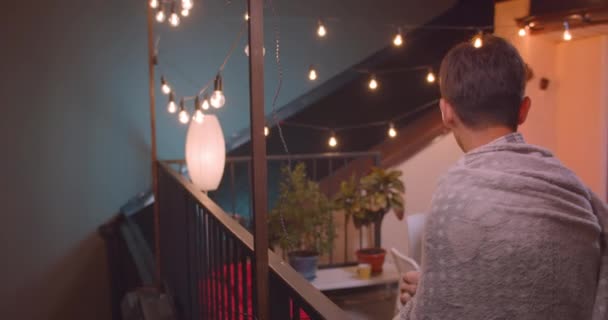 Closeup portrait of young asain male standing happily alone and joining diverse multiracial group of friends at party with fairy lights — Stock Video