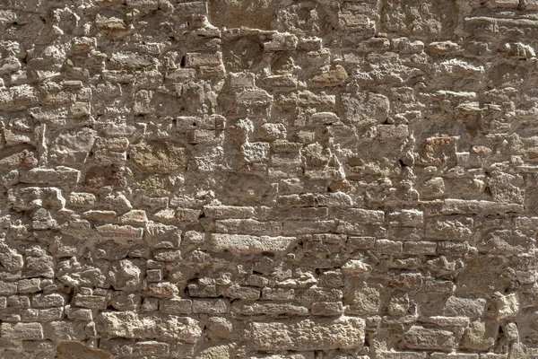 Rustic wall texture of irregular stones