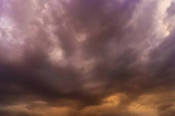 Dramatic sky with purple and orange clouds