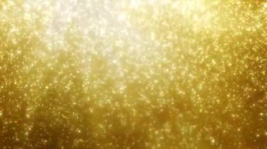Düşen parlak parçacıkların altın arkaplanı
