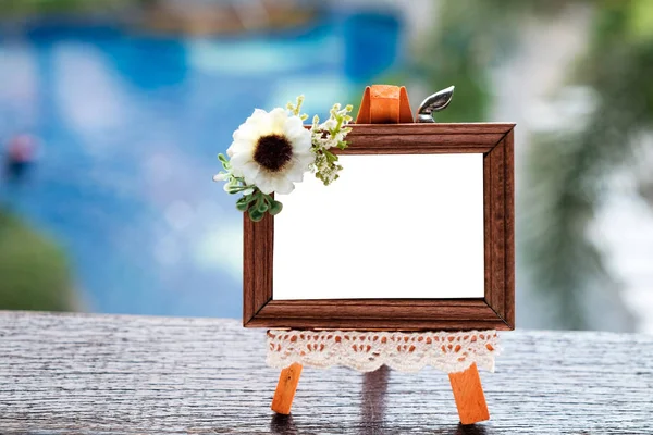 Small Cute Wood Picture Frame Outdoor by Side of the Swimming Pool.