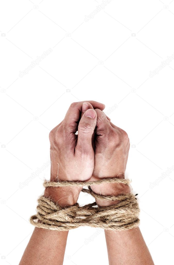 victim, slave, prosoner male hands tied by big rope isolated on the white background. People have no freedom concept image.