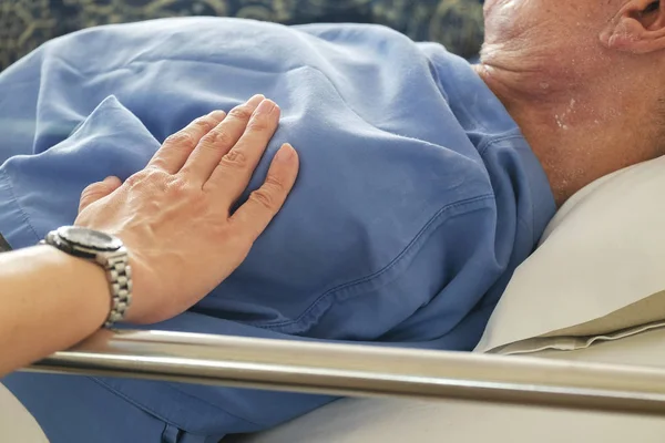 Woman Touched and Praying For Sick Old Man in the Hospital.