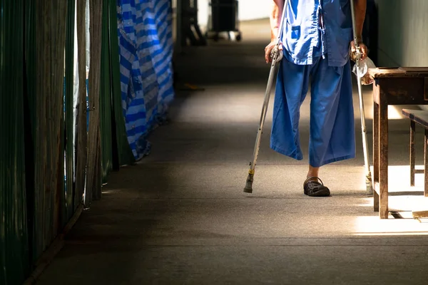 Disabled Old Man Walking in the Small Walk Path in the Hospital.