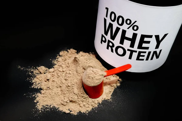 Whey Protein Powder in measuring scoop.