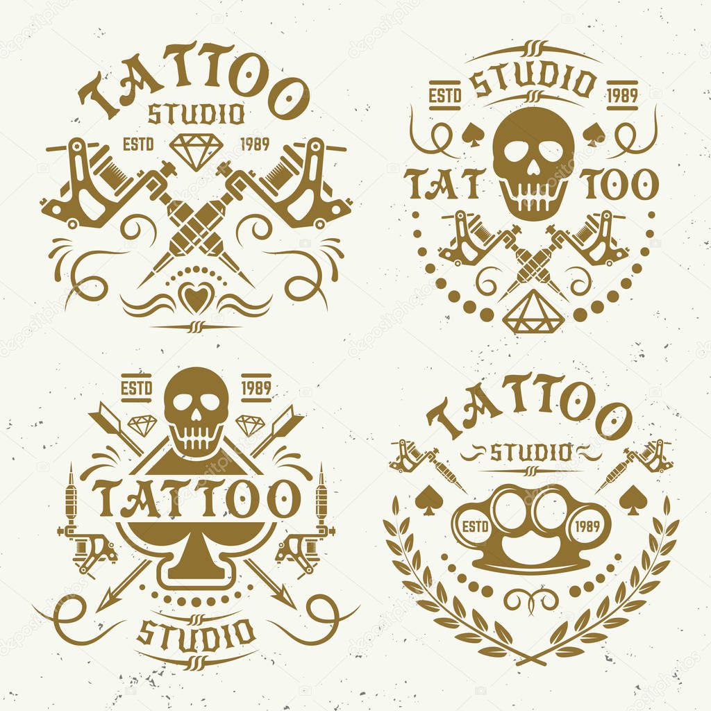 Tattoo studio set of four vector vintage gold color labels, emblems, or logo templates, on light background with grunge texture, tattoo machine emblem, tattoo style t-shirt prints