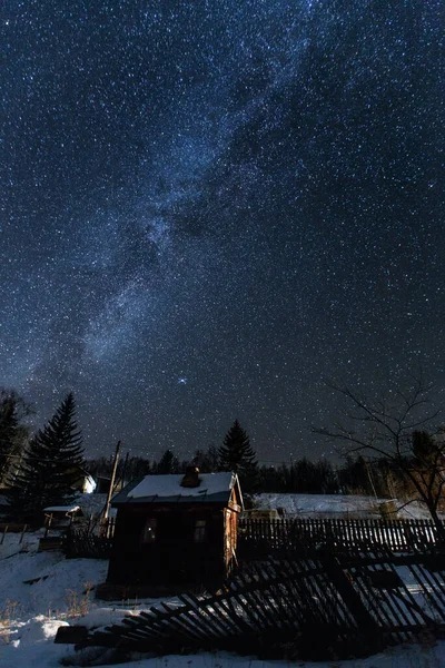 Russian village. Starry sky over the winter village of Agzu in the north of Primorsky Krai