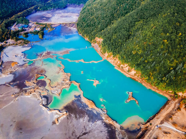 View from above. Blue waters of the former tailing dump in the village of Kavalerovo. Khrustalnensky ore mining and processing plant