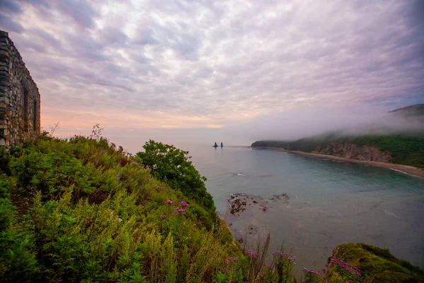 View from above. Kekura sea rock Two brothers in the village of Rudnaya Pristan. Landmark of the north of the Primorsky Territory, depicted on a banknote of 1 thousand rubles, sample of 1997