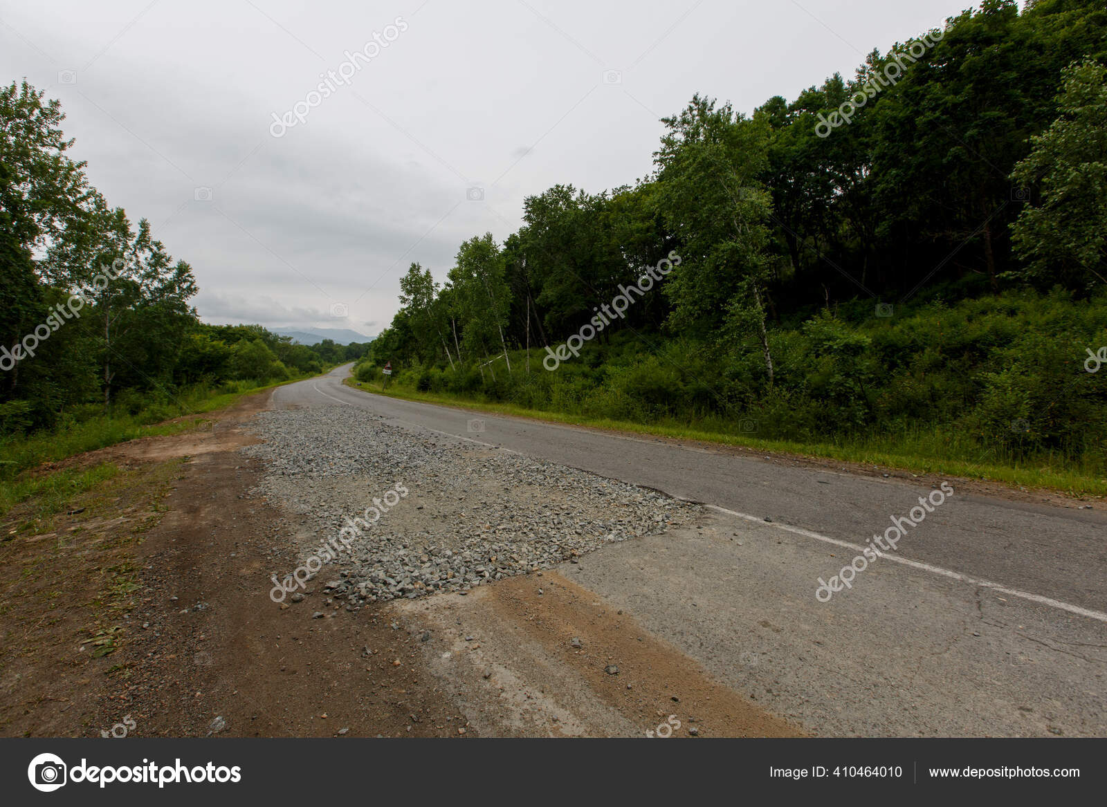 Very Bad Road In Russia The Asphalt Road Is All In Holes In The Middle Of The Forest Stock Photo By C Primdiscovery