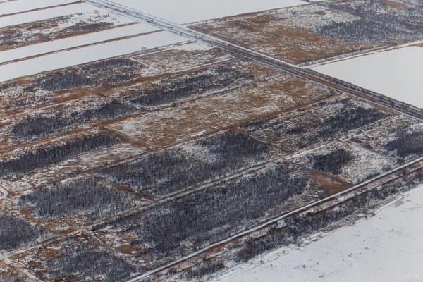 Blick von oben. Landwirtschaftliche Felder im Winter — Stockfoto