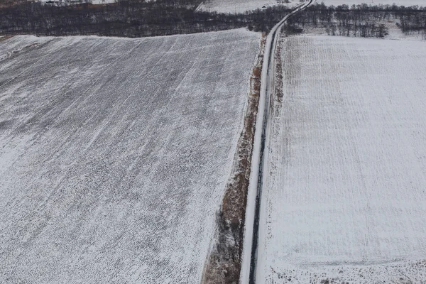 Blick von oben. Landwirtschaftliche Felder im Winter — Stockfoto