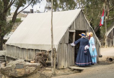 Ladies in traditional costume in Sovereign Hill, an open air museum in Golden Point, a suburb of Ballarat, Victoria, Australia. Sovereign Hill depicts Ballarat's first ten years after the discovery of gold there in 1851. clipart