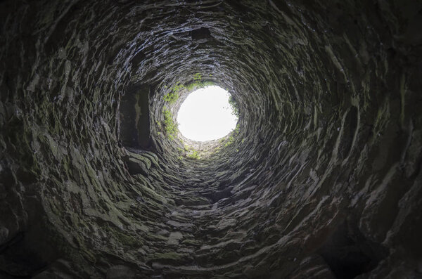 View looking up into one of the stone towers of the Strand Gate, ancient stone gateway, in the small town of Winchelsea, East Sussex