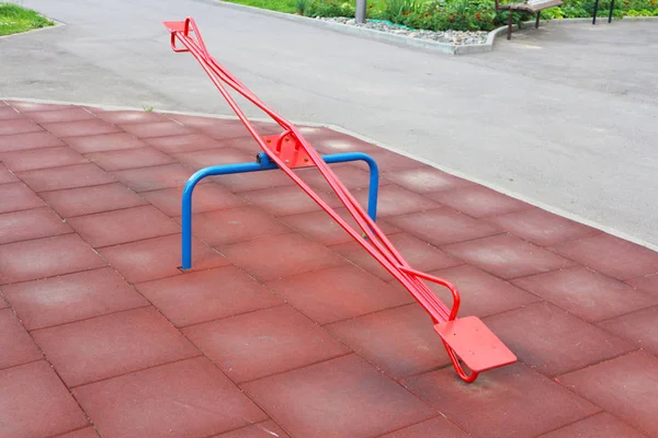 See saw swing at sunny playground.