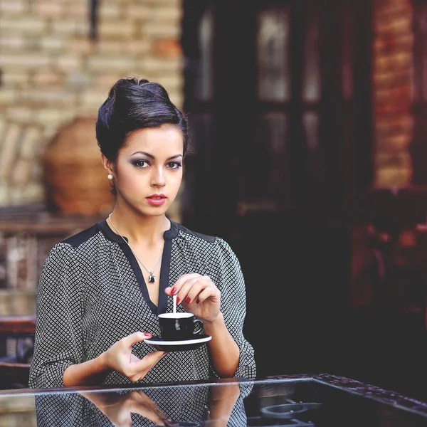 Woman with a cup of coffee — Stock Photo, Image