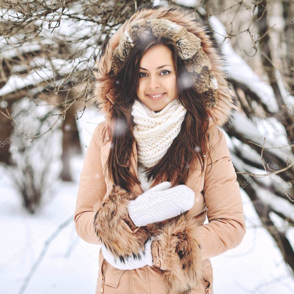 Portrait of a beautiful girl in winter 