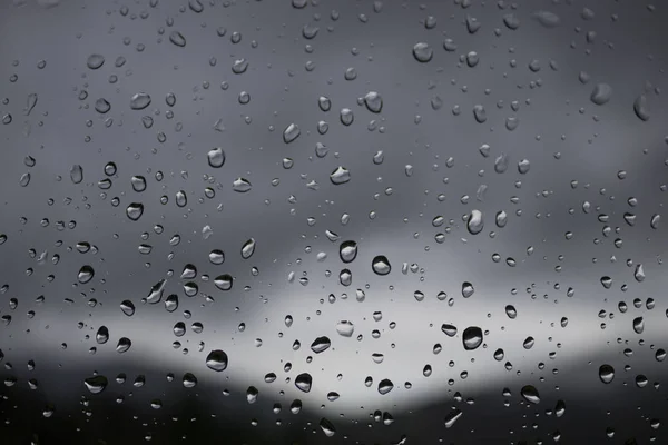 Raindrops on the window. Rainy weather. Rain in the Carpathians