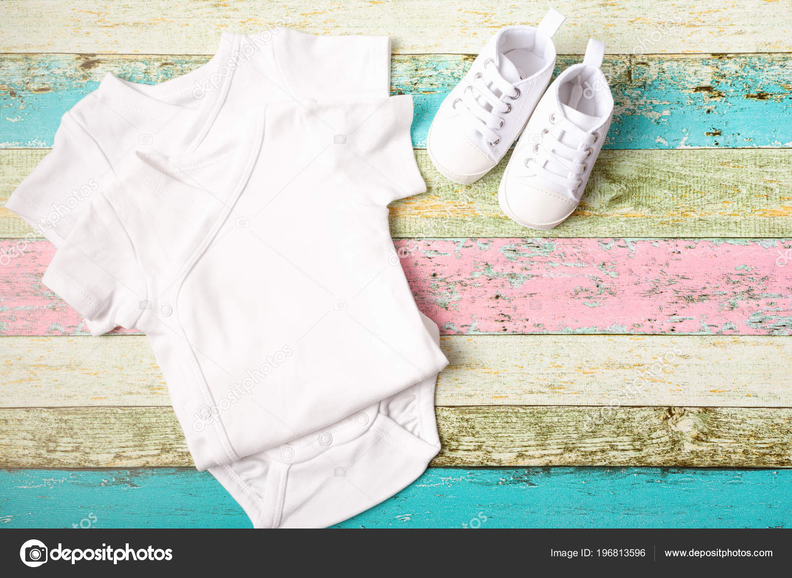 Download White Baby Onesie And Sneakers Over Pastel Wooden Background Good For Insert Your Design Mock Up Stock Photo Image By C Annidr 196813596