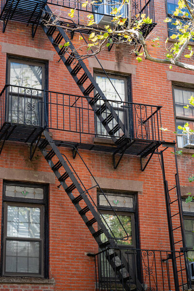 New York City East village building details with fire escapes. Background texture pattern of Buildings