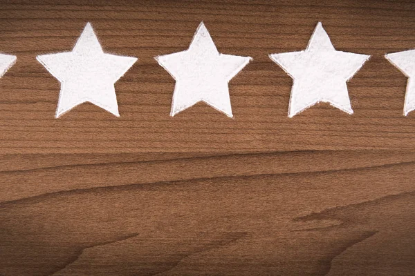 Star rating for product quality on cooking background, top view.