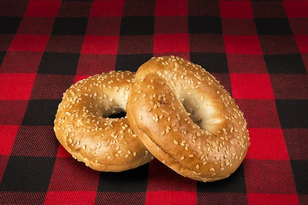 Fresh Sesame Seed Bagel Bread Isolated Tartan Red Black Tablecloth — Stock Photo, Image