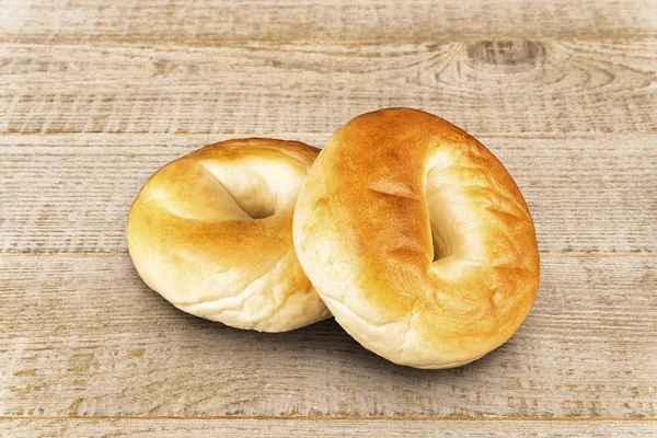 Close Set Plain Bagel Isolated White Plank Background — Stock Photo, Image