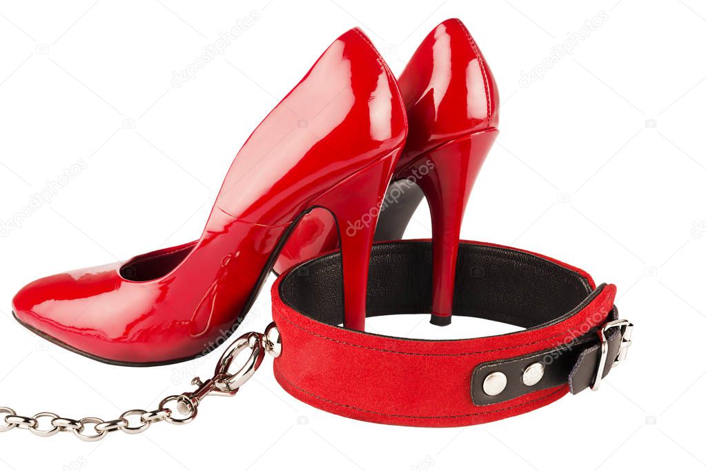 Red high heels and dog collar isolated on white background. Bondage concept.