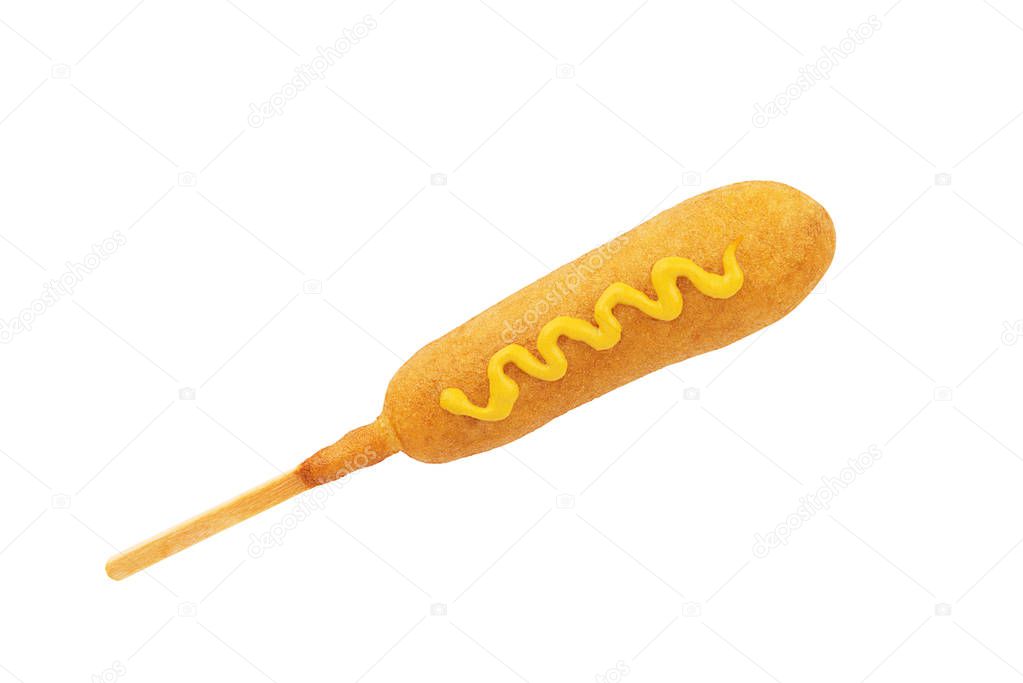 Corn dog with mustard line on top, isolated on a white background.