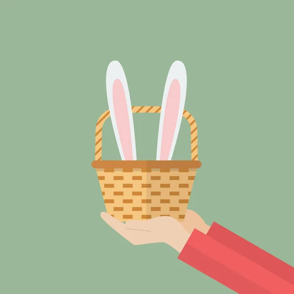 Hand holding basket with bunny ears — Stock Vector