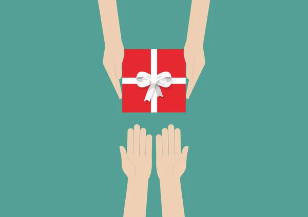 Mains tenant un cadeau ou une boîte cadeau — Image vectorielle