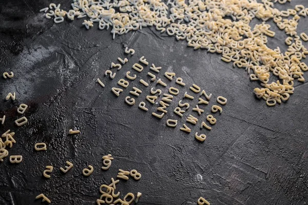 Pasta-Alphabet und Zutat für Sauce — Stockfoto