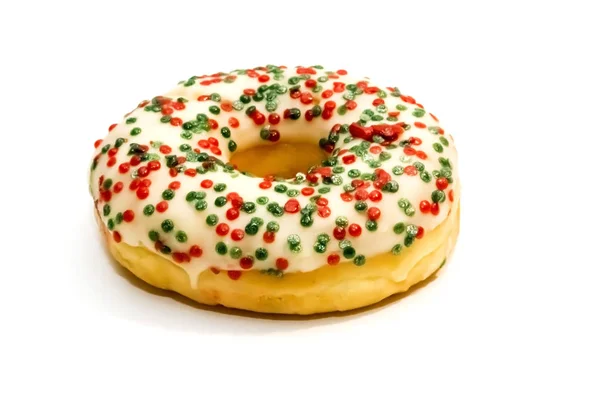 Doce saboroso donut com polvilhas coloridas isoladas nas costas brancas — Fotografia de Stock