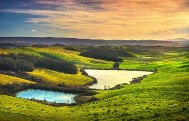 Tuscany, small lakes and rural landscape on sunset, Siena Italy. clipart