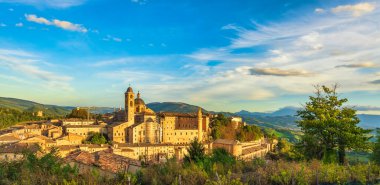 Urbino city skyline and Ducal Palace at sunset. Unesco world heritage site. Marche region, Italy, Europe. clipart