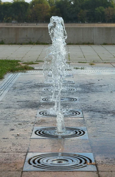 Several small ground fountains in one line — Stock Photo, Image