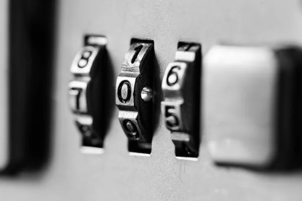 Combination padlock close up with chrome numbers. Mechanical combination lock, counter. Selective focus