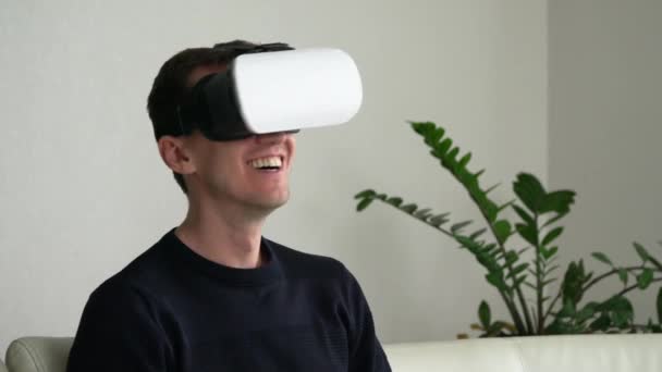 Young Man Virtual Reality Glasses Smiles Laughs Close — Stock Video