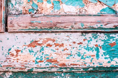 ahşap bir yüzey üzerinde mavi boya kırık