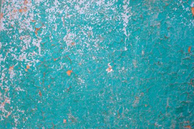 ahşap bir yüzey üzerinde mavi boya kırık