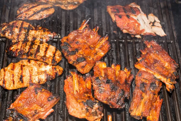 Pork Back Ribs Chicken Breast Being Grilled Barbecue Grill Marks — Stock Photo, Image
