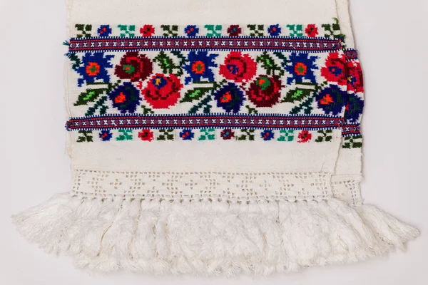 Closeup of Eastern European embroidery design with floral motifs found on towels and clothing.