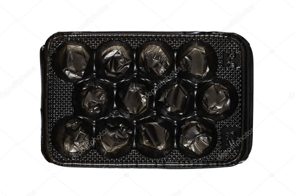 Black plastic packaging box tray liner for fruit and vegetable packing isolated on white with clipping paths at all sizes.