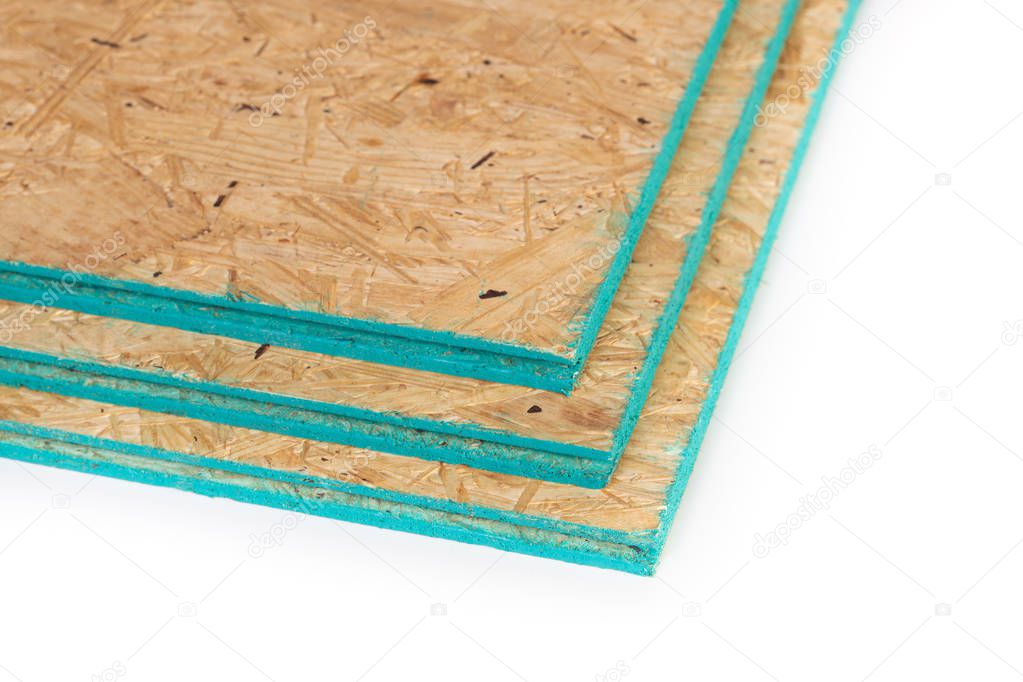 Sub flooring boards made of wood chips isolated on a white with copy space.