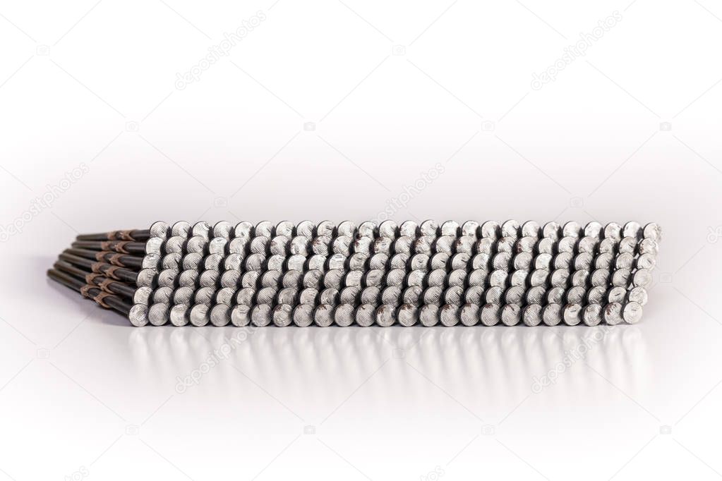 Nail gun nails used in a framing nail gun isolated on a white background.
