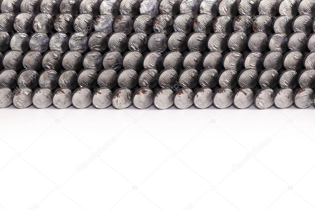 Nail gun nails used in a framing nail gun isolated on a white background.