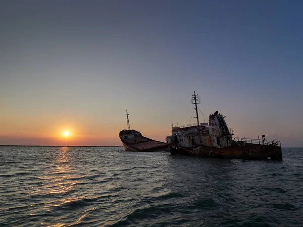 abandoned ship wreck in Sulina, Romania at sunset
