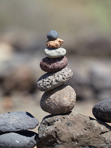 stack of stones on the beach - ancient ritual for good fortune and prosperity