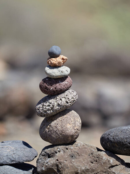 stack of stones on the beach - ancient ritual for good fortune and prosperity